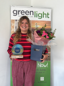Chloe Brindley holding the Innovation in Care award 2026.